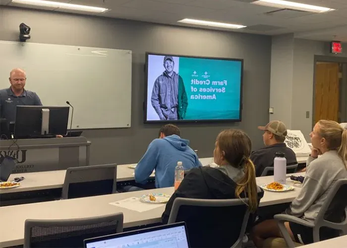 a guest speaker presents to students in the agribusiness club